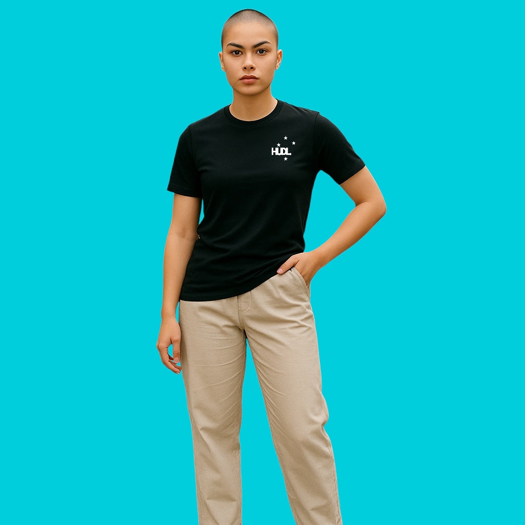 A woman wearing HUDL SuperNatural squash tee – Cotton-Tencel-Nylon blend, soft performance feel on and off court in black 
